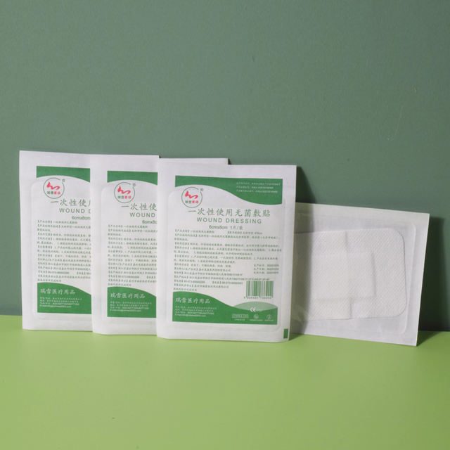 Self-adhesive wound dressing, non-woven