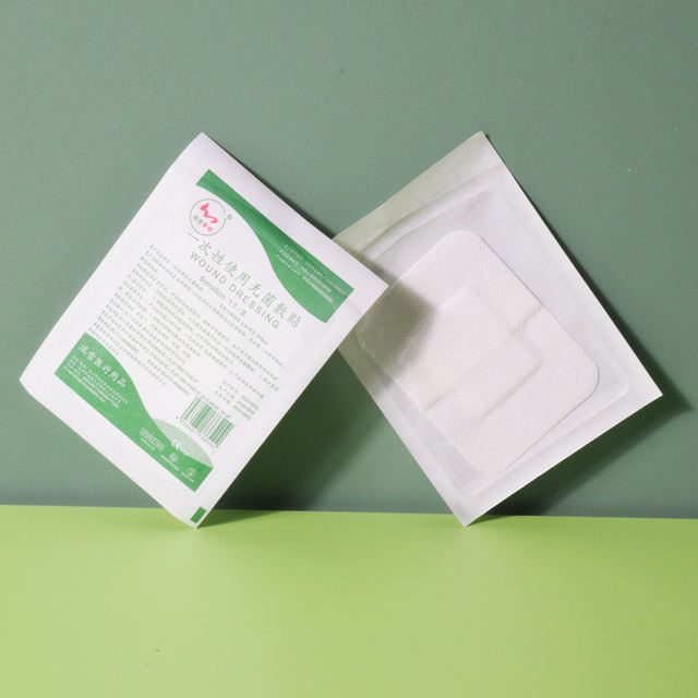 Adhesive wound dressing, non-woven
